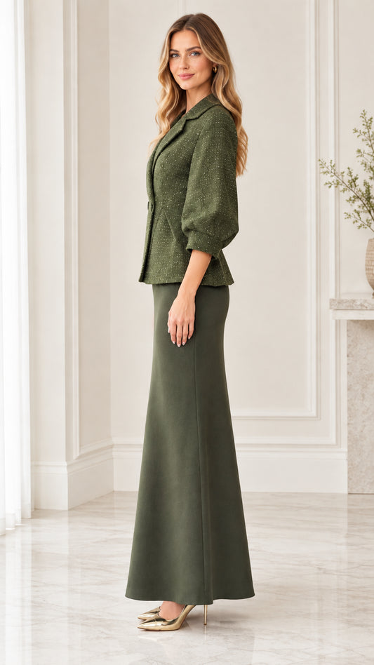 Side profile view of woman wearing olive green peplum jacket and maxi skirt