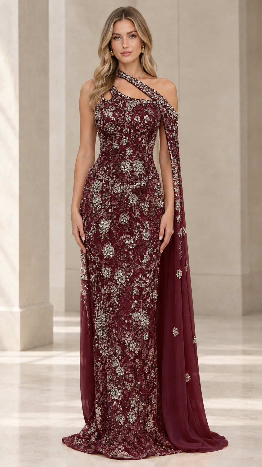 Front view of burgundy wine embellished lace evening gown with one-shoulder cape drape