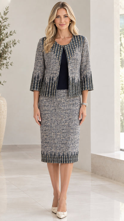 Full front view of women wearing slate grey tweed two-piece skirt suit with beaded trim