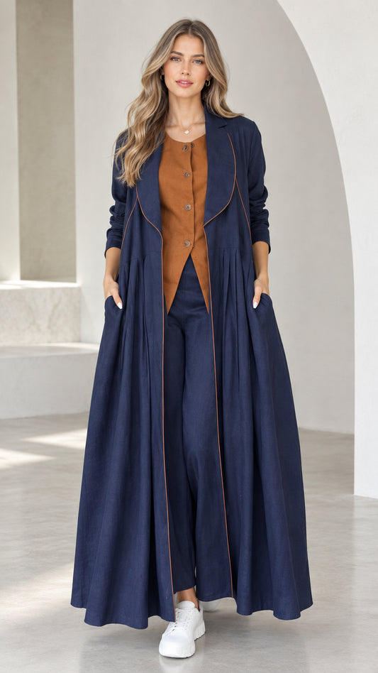 Front view of model wearing Navy Blue pleated maxi duster coat