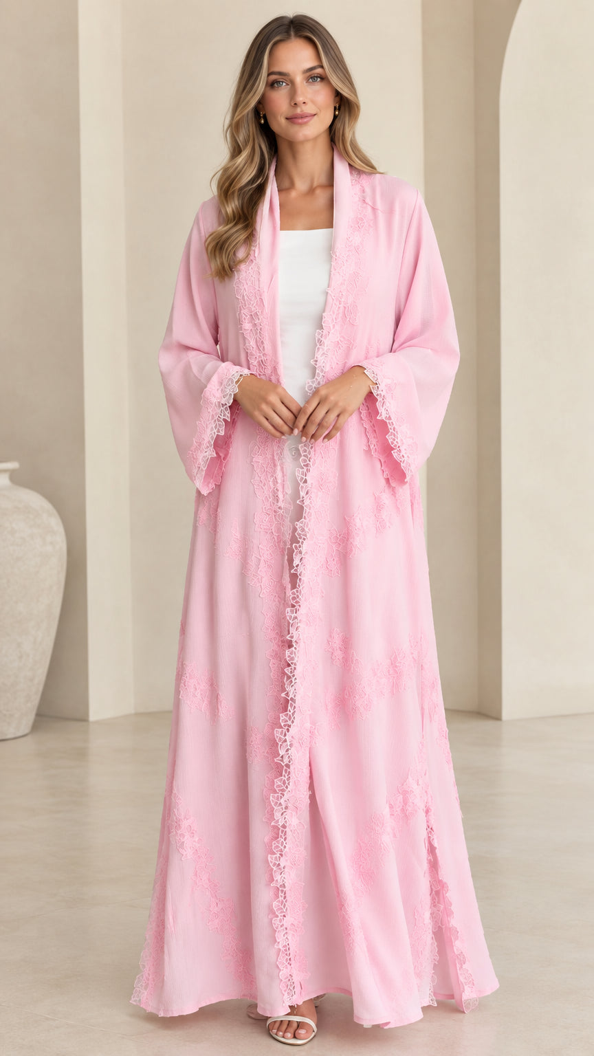 Full front view of model wearing pink lace-trimmed open front maxi abaya