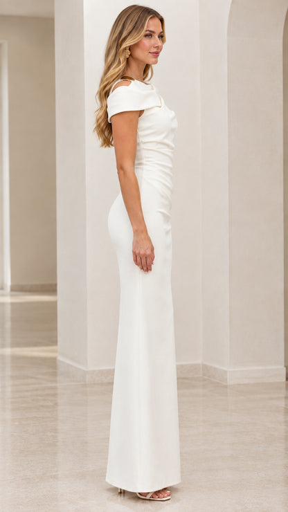 Side profile of white floor-length formal gown with draped neckline