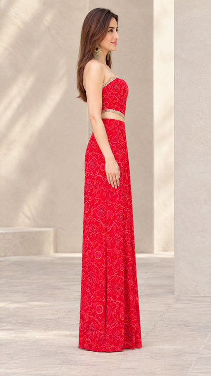 Side profile of woman in Red printed two-piece draped skirt set