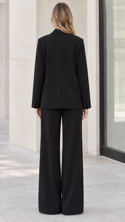 Back full-length view of black tailored blazer and wide-leg trousers