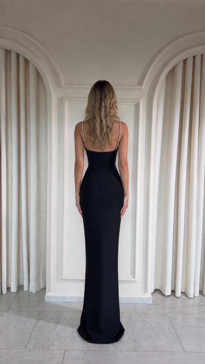 Black floor-length evening gown back view with delicate straps