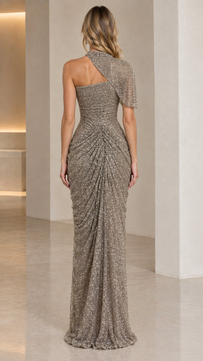 Back view of model in floor-length taupe draped sequin evening dress
