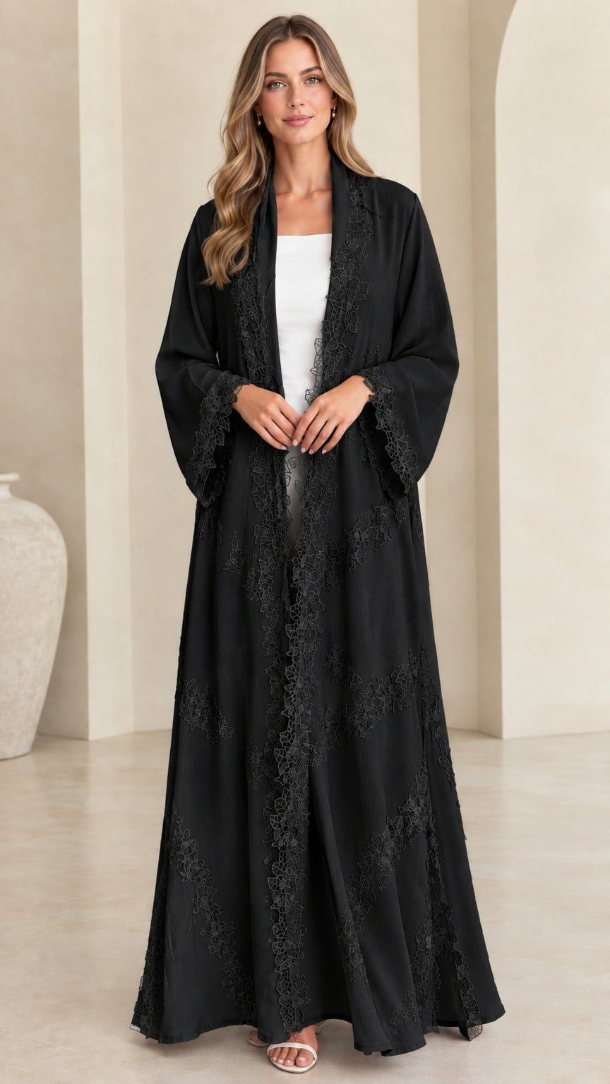 Front view of model wearing classic black lace trim open maxi abaya cardigan
