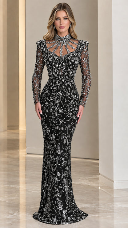 Model wearing Black crystal embellished long sleeve floor-length gown