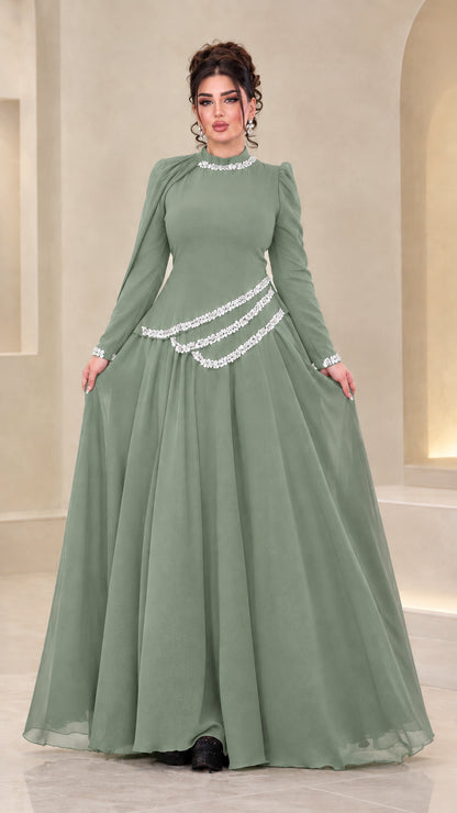 Front view of model wearing sage green rhinestone chiffon evening gown