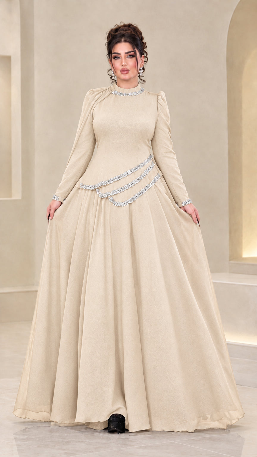 Front view of model wearing champagne beige rhinestone chiffon maxi gown